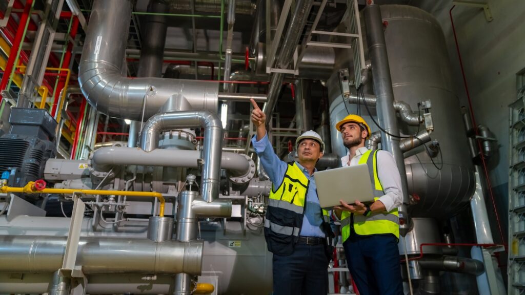 industrial-plant-two-supervisors-discussing-operations